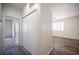 Hallway with a closet and access to carpeted and wood-style-floored rooms at 8564 Lost Gold Ave, Las Vegas, NV 89129