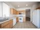 Open kitchen area with stainless steel appliances and connecting living space at 8564 Lost Gold Ave, Las Vegas, NV 89129
