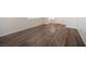 Beautiful wood-look flooring extends throughout this spacious living area, complemented by fresh paint and ample natural light at 8564 Lost Gold Ave, Las Vegas, NV 89129
