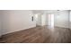 Spacious living room showcasing wood-look flooring and an open layout perfect for entertaining and modern living at 8564 Lost Gold Ave, Las Vegas, NV 89129