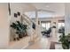 Inviting entryway featuring a staircase with white railing, neutral walls, and stylish decor at 890 Socorro Song Ln, Henderson, NV 89052