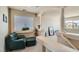 Upstairs hallway with an open view of a seating area with lots of natural light at 890 Socorro Song Ln, Henderson, NV 89052