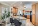 Eat-in kitchen features stone countertops, wood cabinetry, and black appliances at 890 Socorro Song Ln, Henderson, NV 89052