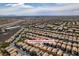 This aerial view presents 9478 Milkweed Canyon Ave within its community, highways, and distant city skyline at 9476 Milkweed Canyon Ave, Las Vegas, NV 89166