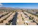 Wide aerial view of a residential neighborhood with mountain views in the distance at 9476 Milkweed Canyon Ave, Las Vegas, NV 89166