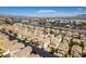 Aerial view showcasing the neighborhood's layout and proximity to commercial areas at 9476 Milkweed Canyon Ave, Las Vegas, NV 89166