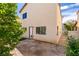Cozy backyard featuring artificial turf, stone pathway, and easy rear access at 9476 Milkweed Canyon Ave, Las Vegas, NV 89166