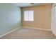 A simple bedroom with a window and white closet at 9476 Milkweed Canyon Ave, Las Vegas, NV 89166