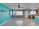 Bright living room featuring tile floors, a ceiling fan, neutral paint, and plenty of natural light at 9476 Milkweed Canyon Ave, Las Vegas, NV 89166