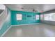 Spacious living room with tile flooring and brightly painted blue accent wall at 9476 Milkweed Canyon Ave, Las Vegas, NV 89166
