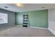 Spacious carpeted loft featuring a window and stylish decor at 9476 Milkweed Canyon Ave, Las Vegas, NV 89166