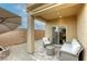 Cozy back patio with comfortable seating and modern accents at 9535 Vega Carpio Ave, Las Vegas, NV 89178