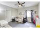 Nicely decorated bedroom with ceiling fan, themed decor, and comfy area for playing at 9535 Vega Carpio Ave, Las Vegas, NV 89178