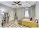 Tastefully decorated bedroom with a modern design, a ceiling fan, and neutral decor at 9535 Vega Carpio Ave, Las Vegas, NV 89178