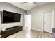 Modern living room featuring a television, neutral walls, and a media console at 9535 Vega Carpio Ave, Las Vegas, NV 89178