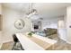 Open concept living space with modern light fixtures, inviting decor and stylish flooring at 9535 Vega Carpio Ave, Las Vegas, NV 89178
