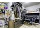 Well-organized walk-in closet featuring custom shelving, drawers, and desk/vanity area at 9535 Vega Carpio Ave, Las Vegas, NV 89178