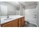 Bright bathroom boasts a large vanity, spacious countertop, and combined tub and shower, blending style and functionality at 9750 Maple Sugar Leaf Pl, Las Vegas, NV 89148