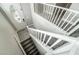 Bright entryway features a front door with decorative glass and a staircase with white railings at 9750 Maple Sugar Leaf Pl, Las Vegas, NV 89148