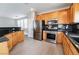 Spacious kitchen with stainless steel appliances, granite counters, and tile flooring at 9750 Maple Sugar Leaf Pl, Las Vegas, NV 89148