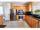 Beautiful kitchen with stainless steel appliances, granite countertops, and wood cabinetry at 9750 Maple Sugar Leaf Pl, Las Vegas, NV 89148