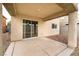 Covered patio with sliding glass door, offering a seamless transition to indoor/outdoor living at 9750 Maple Sugar Leaf Pl, Las Vegas, NV 89148