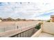 Balcony view overlooking the community with houses and desert landscape in the distance at 9750 Maple Sugar Leaf Pl, Las Vegas, NV 89148