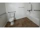 Bathroom features include a tile floor, white toilet, and accessible grab bars in the shower and tub area at 9975 Peace Way # 1140, Las Vegas, NV 89147