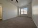 Bedroom with neutral carpet, ample wall space, a bright window and a ceiling fan at 9975 Peace Way # 1140, Las Vegas, NV 89147