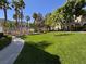 Expansive community lawn space offers a serene and inviting area for outdoor activities and relaxation at 9975 Peace Way # 1140, Las Vegas, NV 89147