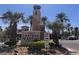 The Chateau Nouveau community sign and entrance is surrounded by palm trees at 9975 Peace Way # 1140, Las Vegas, NV 89147