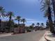 A view of the Chateau Nouveau entrance sign, palm trees, and community at 9975 Peace Way # 1140, Las Vegas, NV 89147
