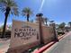 Chateau Nouveau community entrance sign surrounded by palm trees and landscaping at 9975 Peace Way # 1140, Las Vegas, NV 89147