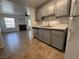 Open-concept kitchen view showcases the kitchen island, updated appliances, and adjacent living area at 9975 Peace Way # 1140, Las Vegas, NV 89147