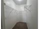 This is a walk-in closet with white walls, brown carpet, and wire shelving at 9975 Peace Way # 1140, Las Vegas, NV 89147