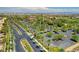 Scenic aerial shot of community with palm tree lined streets and green landscape at 10241 Premia Pl, Las Vegas, NV 89135