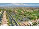 Wide aerial view of the community showcasing golf course, lush greenery, and convenient parking at 10241 Premia Pl, Las Vegas, NV 89135