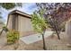 Exterior view of the home featuring a low-maintenance backyard and enclosed patio at 10241 Premia Pl, Las Vegas, NV 89135