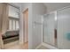 Ensuite bathroom with glass-enclosed shower stall and view into an adjacent bedroom at 10241 Premia Pl, Las Vegas, NV 89135