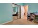 Bedroom features neutral carpet, bright paint, mirrored closet, and open doorway at 10241 Premia Pl, Las Vegas, NV 89135
