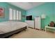 Bedroom features neutral carpet, bright paint, and window with shutter blinds at 10241 Premia Pl, Las Vegas, NV 89135