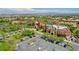 Community clubhouse with well-manicured landscaping, ample parking, and Mediterranean-style architecture at 10241 Premia Pl, Las Vegas, NV 89135
