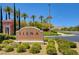 Siena community entrance sign surrounded by manicured shrubs and tall trees at 10241 Premia Pl, Las Vegas, NV 89135