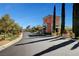 Elegant Siena community entrance with manicured landscaping and guard house at 10241 Premia Pl, Las Vegas, NV 89135