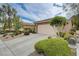 Charming single-story home featuring a two-car garage, desert landscaping, and a convenient mailbox at 10241 Premia Pl, Las Vegas, NV 89135