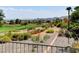 Scenic golf course view with lush greenery and desert landscaping from a backyard at 10241 Premia Pl, Las Vegas, NV 89135