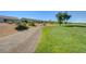 Scenic golf course with mature trees and meticulous landscaping alongside a pathway at 10241 Premia Pl, Las Vegas, NV 89135