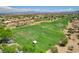 Scenic view of lush green golf course, manicured landscape and expansive community at 10241 Premia Pl, Las Vegas, NV 89135