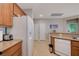 Kitchen includes wooden cabinets, stainless steel appliances, granite countertops, and a breakfast bar perfect for gathering at 10241 Premia Pl, Las Vegas, NV 89135