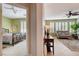 View from the hallway shows access to a bedroom and living room space at 10241 Premia Pl, Las Vegas, NV 89135